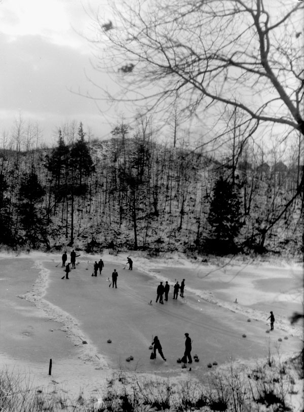 Curling on a pond, High Park, Toronto, 1914